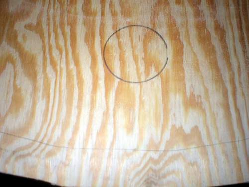 Cutting the baseboard cup holder spots.