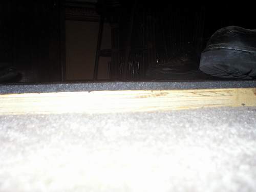 Side view of the foam adhering to the wood.